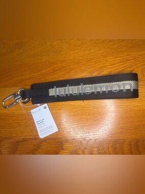 Lululemon Never Lost Keychain Black Logo Strap Clip Wristlet NWT Sold Out